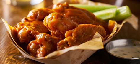 Chicken wings pack at least 43 calories into every wing, depending upon how they are cooked. Baked wings contain 43 calories each, while fried chicken wings contain 61 calories eac...